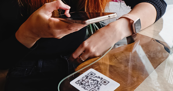 customer scanning digital loyalty card on iphone